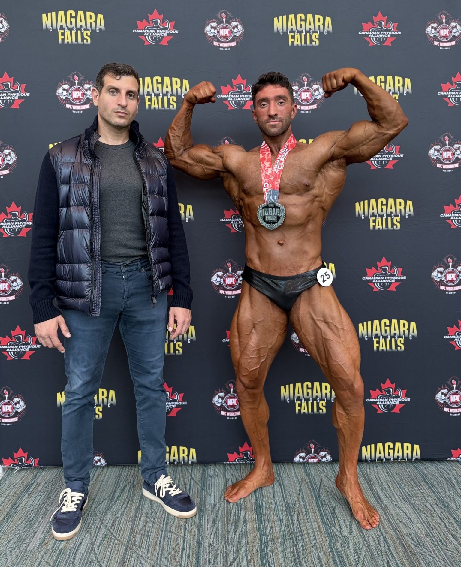 Josh Cooperband competing as a Classic Physique athlete