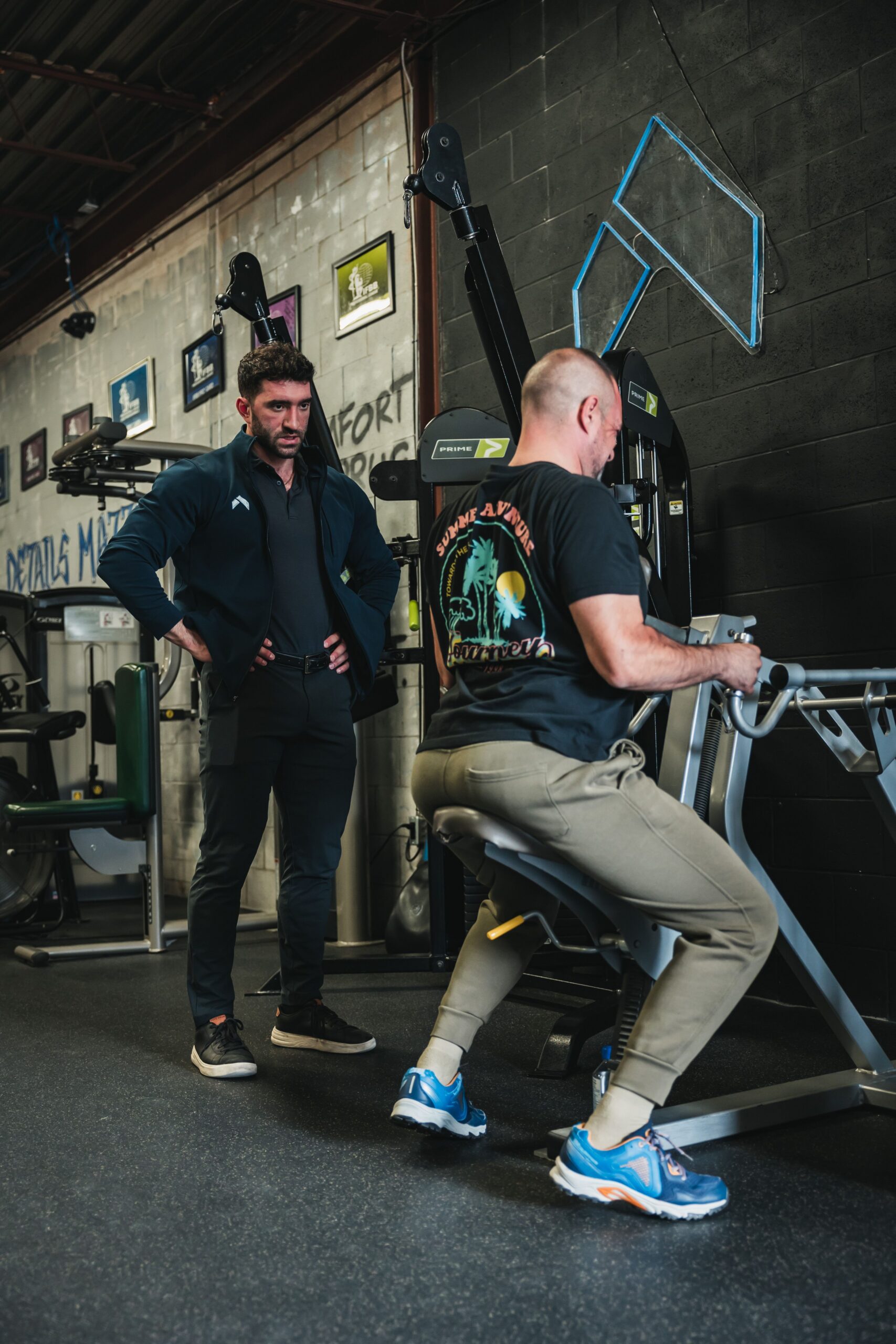 Josh Cooperband coaching a client through a working set at Hammer Fitness, Scarborough Toronto