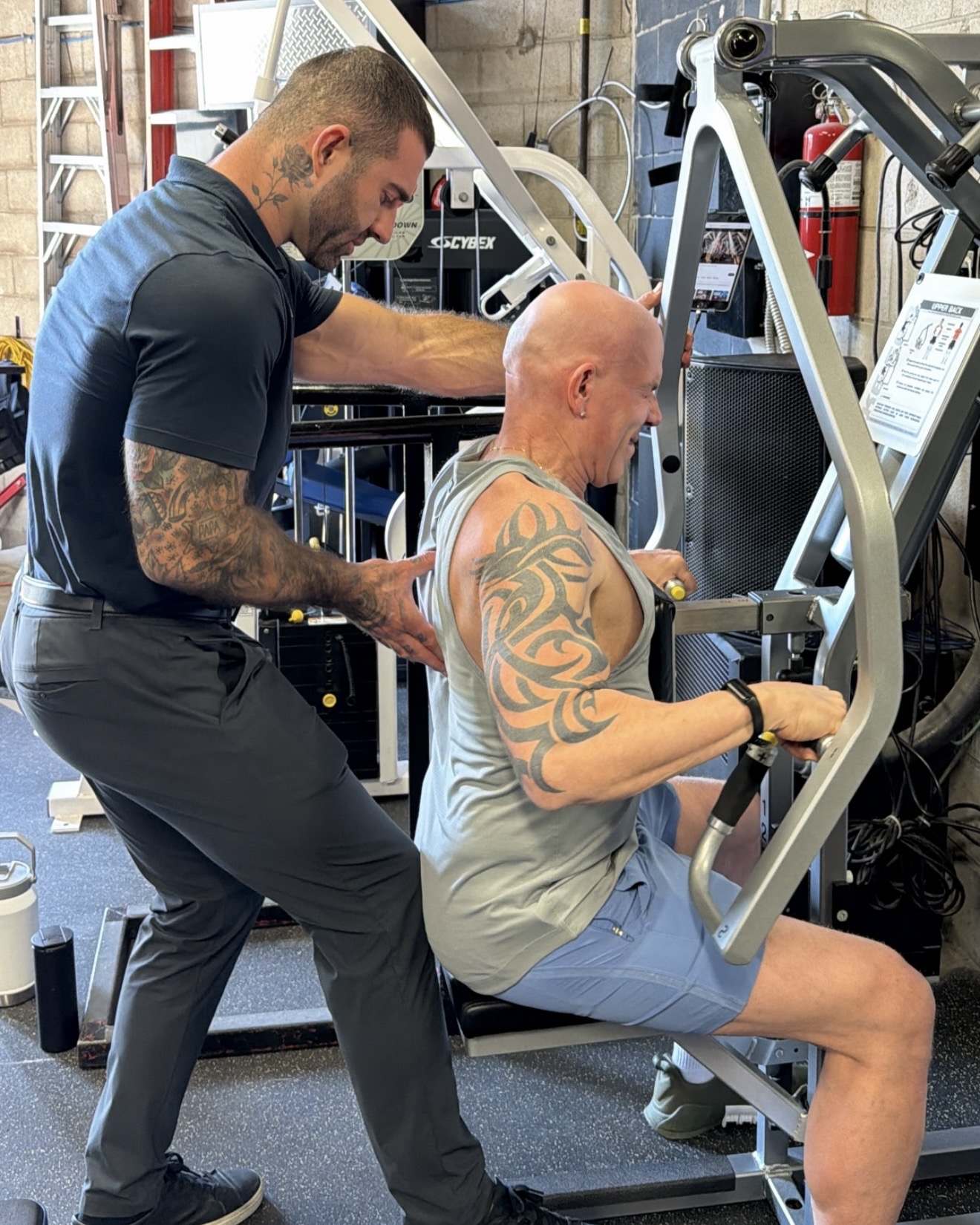 Jase Stevens coaching a client on the training floor at Hammer Fitness in Scarborough, Toronto